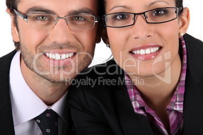 Smiling man woman wearing pairs of eyeglasses