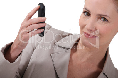 businesswoman holding a cell-phone