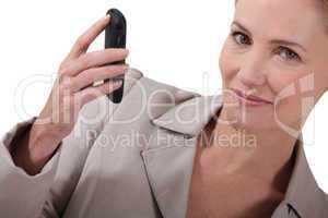 businesswoman holding a cell-phone