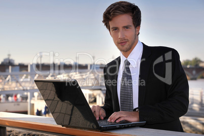 Student using laptop outdoors