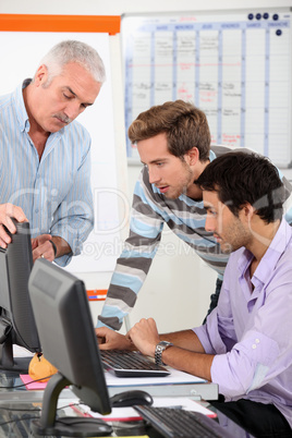 Men connecting to Internet in classroom