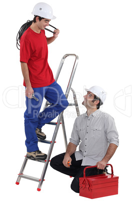 Team of electricians on white background