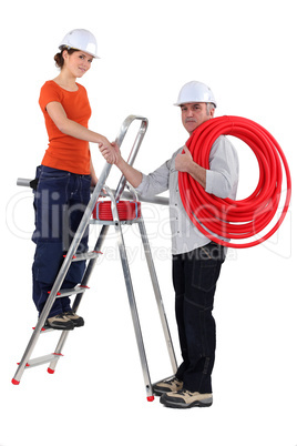 Electricians shaking hands