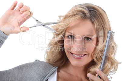 Hairdresser with scissors and a comb