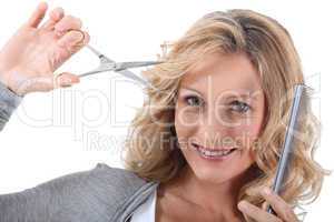 Hairdresser with scissors and a comb