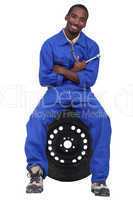 Mechanic sitting on a wheel
