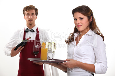 Wine waiter and waitress, studio shot