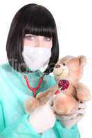 a doctor auscultating a teddy bear