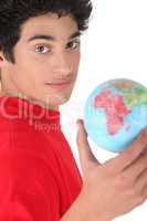 Young brunette with globe