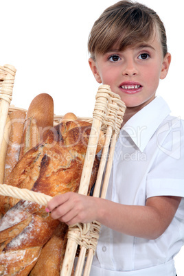 Little girl with basket of bread