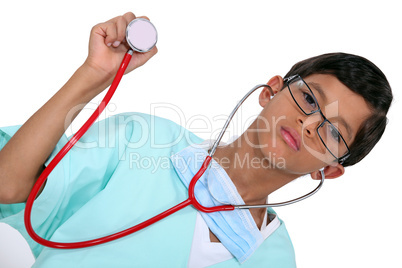Young boy dressed as a medic with a stethoscope