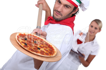 Pizza chef and waitress