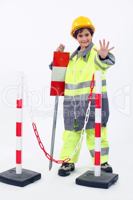 portrait of a little boy in construction clothes
