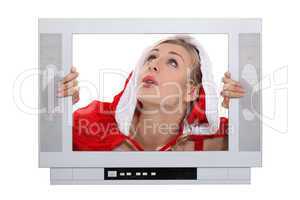 Woman with Christmas layer frame behind TV