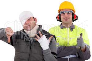 Healthy construction worker standing next to an injured man