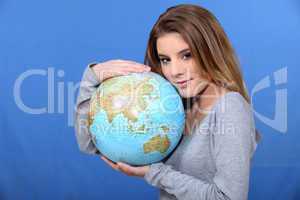 Woman hugging globe