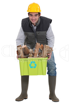 A construction worker recycling.