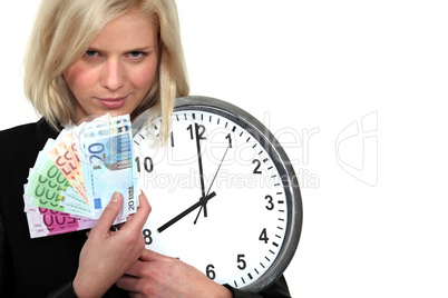 A businesswoman illustrated the concept time is money.