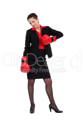 Attractive businesswoman with her punching gloves