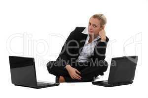 Woman sat with two laptops