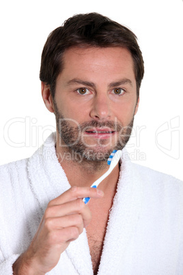 man with toothbrush