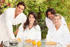 Two couples sharing breakfast