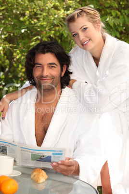 Couple having breakfast outside