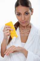 Woman putting on cream