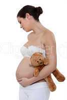 pregnant woman holding a teddy bear
