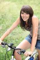 Young woman riding a bike