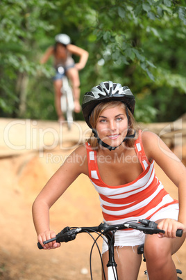Two girls on a bicycle