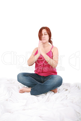 young woman spending yogatic time by herself in the bedroom with