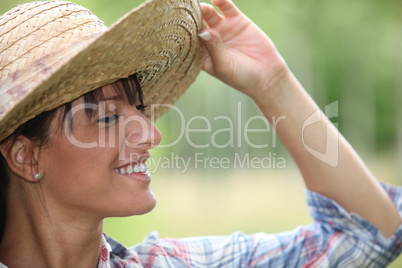 Young woman in a straw hat