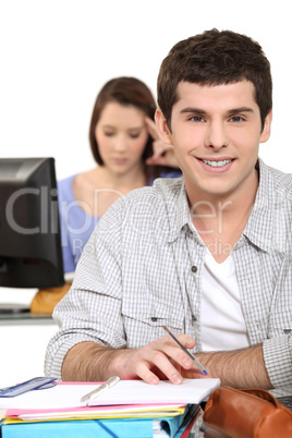 young people studying in a classroom