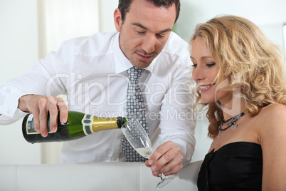 Man pouring glass of champagne