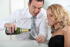 Man pouring glass of champagne