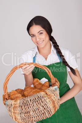 Beautiful woman with basket of croissants