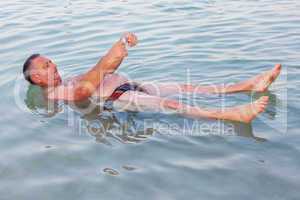 Man floating in the Dead Sea