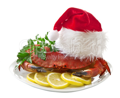 Crab in Santa Claus hat on a platter isolated on white background