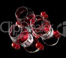 Glasses of wine and chocolate on a black background