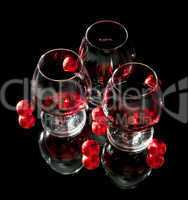 Glasses of wine and chocolate on a black background