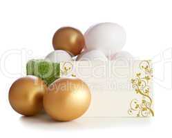 Gold and simple eggs with an invitation card.