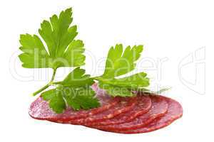 Fresh salami with a parsley branch