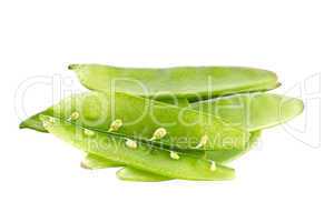 Young green peas on a white background