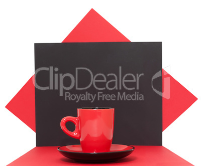 Red coffee cup on a black background