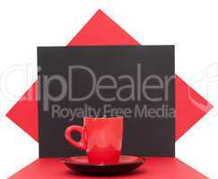 Red coffee cup on a black background