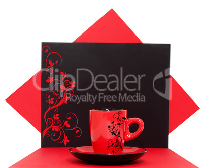 Red coffee cup on a black background