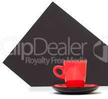 Red coffee cup on a black background
