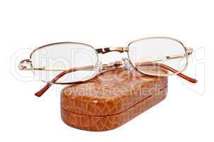 Folding reading glasses with case on a white background