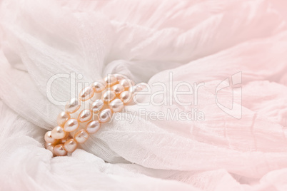 Pink pearls on a Pink  background. Wedding backgrounds.
